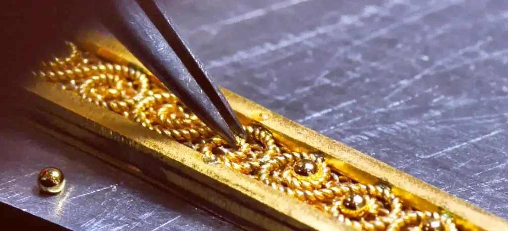 Detailed hand finishing on gold jewellery